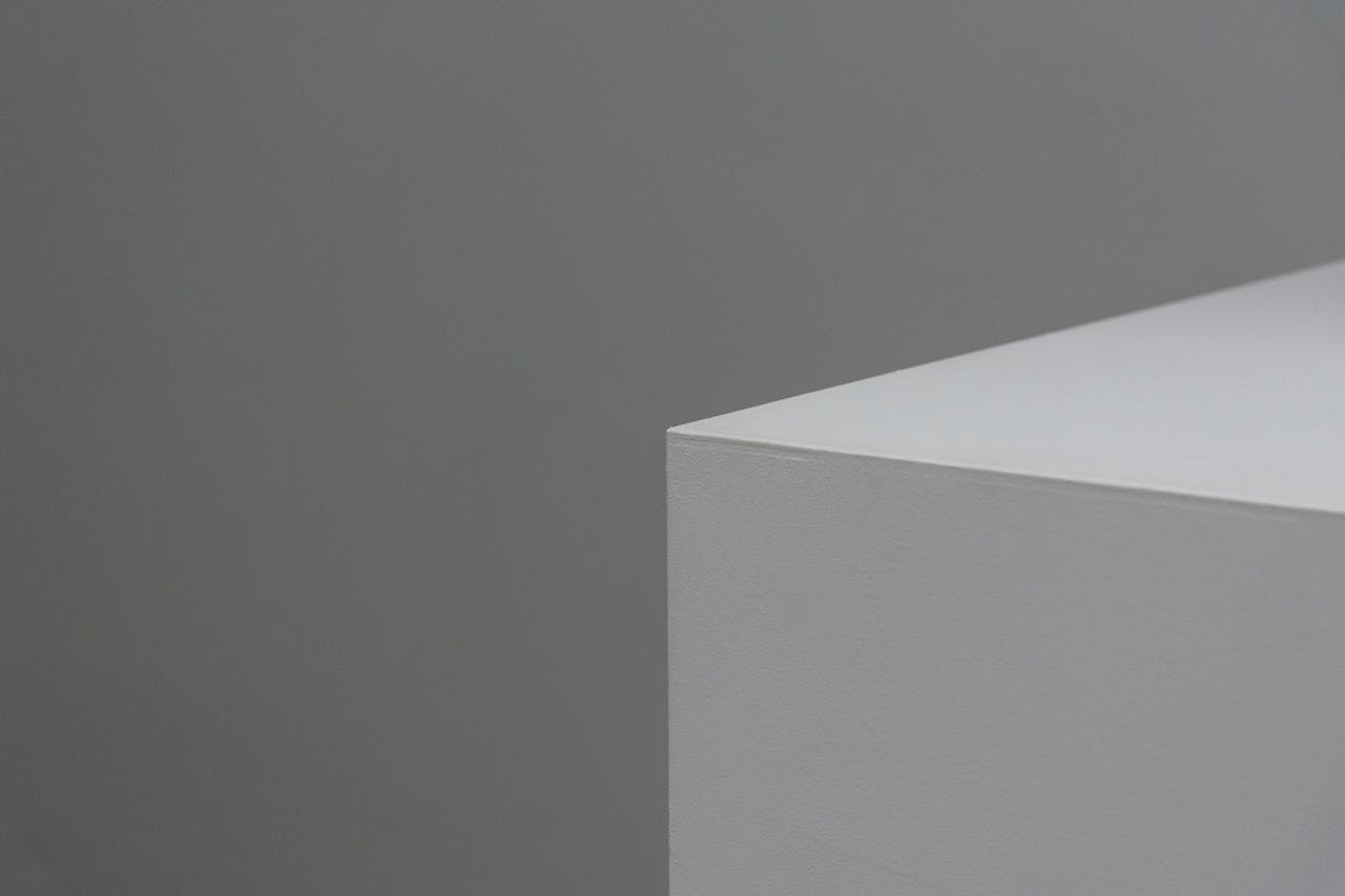 Mastering the First Impression: Your intriguing post title goes here A minimalist image showcasing a sleek geometric shape with neutral grey and white tones.