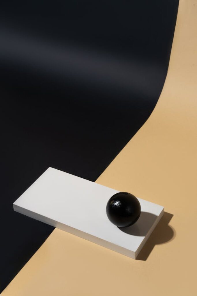 Artistic minimalism featuring geometric forms in a studio setup.